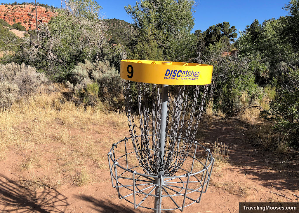 Disc golf basket with a yellow rim