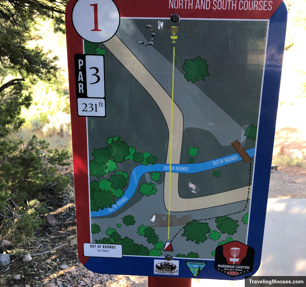 Disc golf sign showing route over a stream