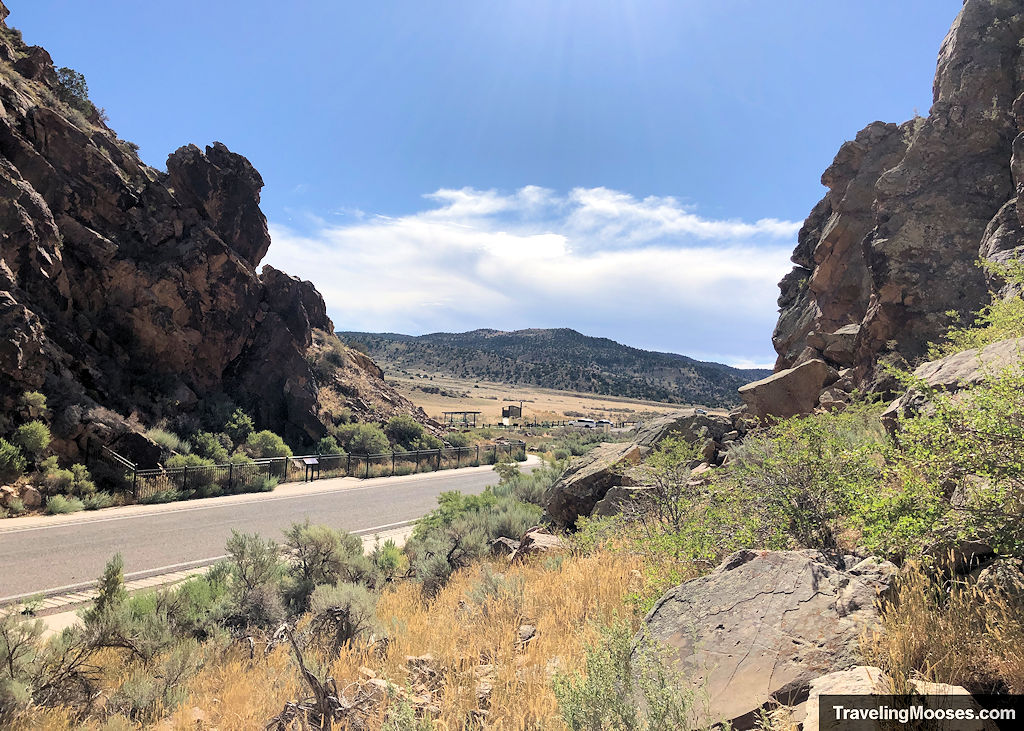 Road traveling through gap in canyon walls