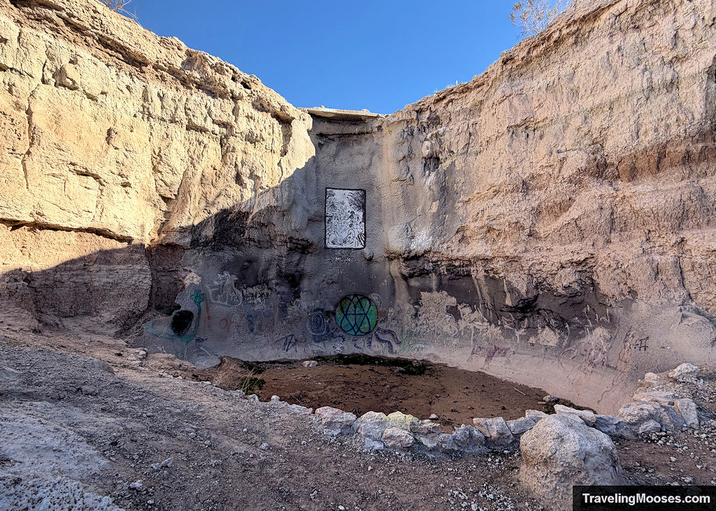 Canyon walls with painted graffit and religious paintings