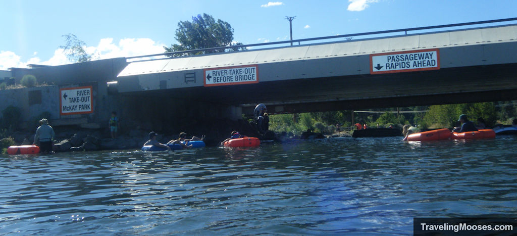 Bridge overpass indicating rapids ahead