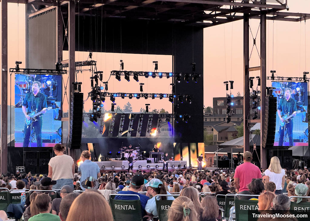 Jimmy eat world playing at a concert on a warm sunny night