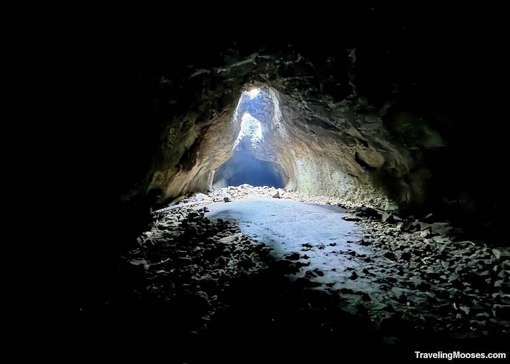 Dark cave with light streaming from above