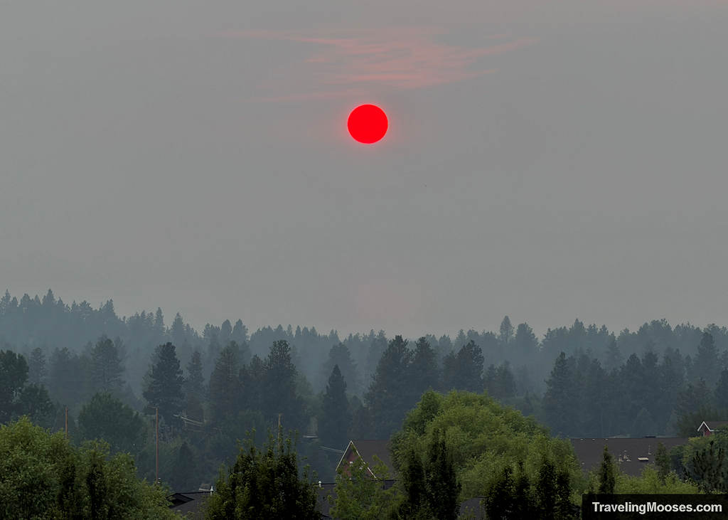 Smoke filled skies with the sun an angry orange