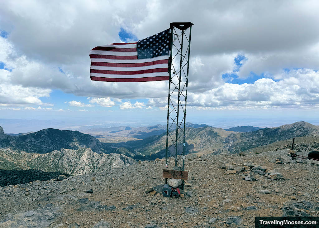 Flagpole at summit flapping in the wind