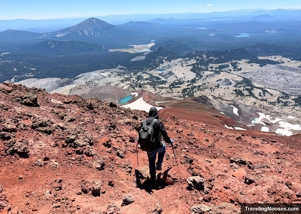 Man walking down scree slope