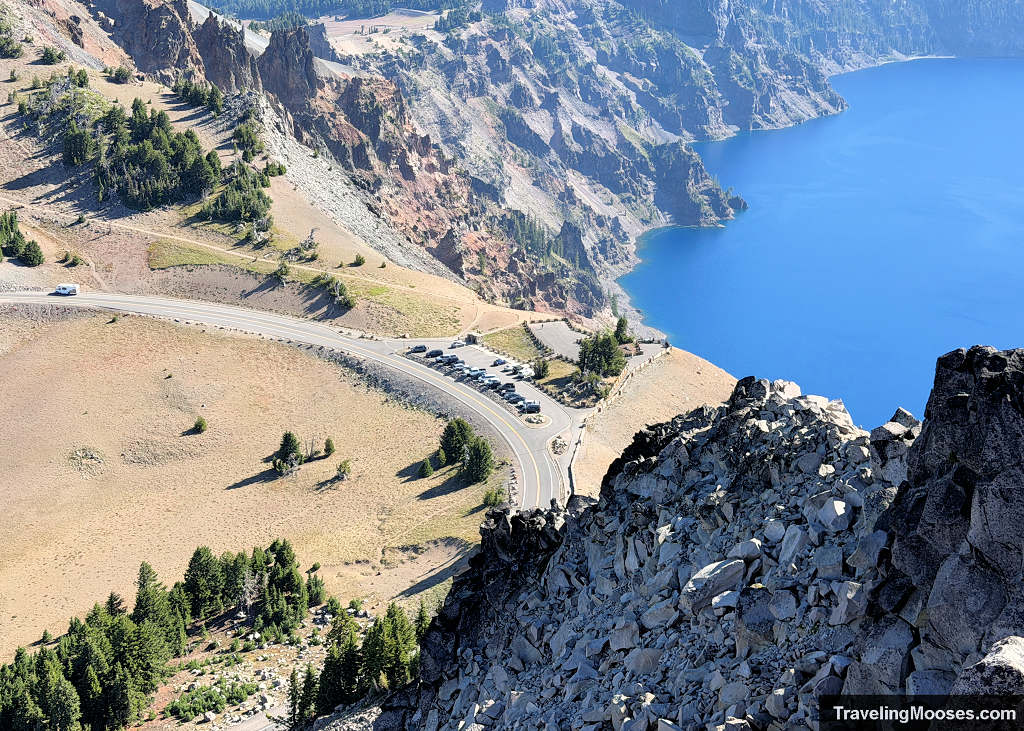 Looking down at a small parking lot fro a cliff