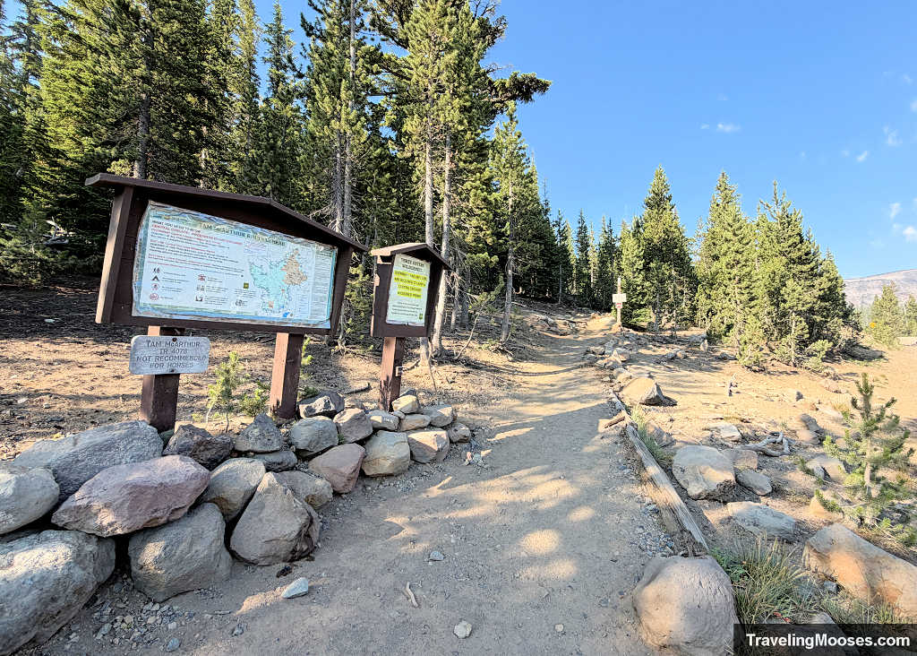 Trailhead sign and wilderness kiosk at the start of the Tam McArthur Rim Trail near Three Creek Lake in Oregon