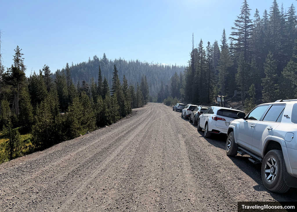 ehicles parked along the gravel shoulder of Forest Road 370 near the Broken Top and Todd Lake trailhead in Oregon