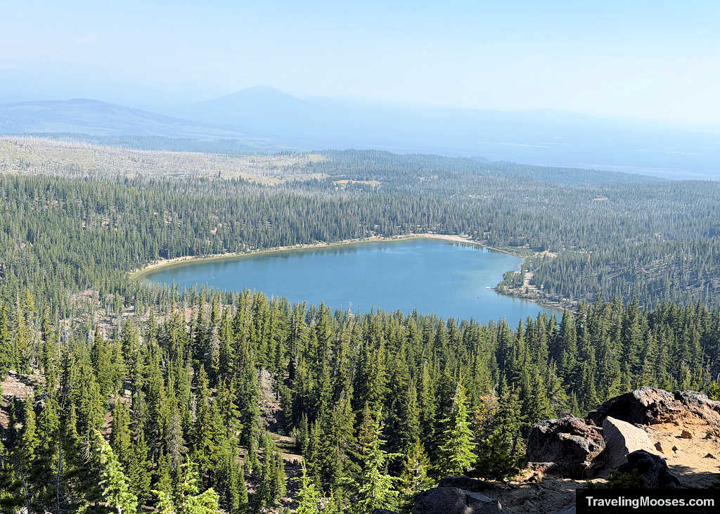 Overhead scenic view of Little Three Creek Lake surrounded by pine forest from the Tam McArthur Rim Trail