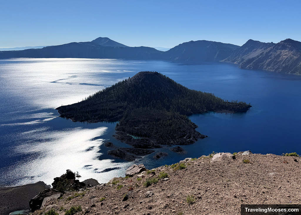 Large volcanic mound in the middle of a blue lake