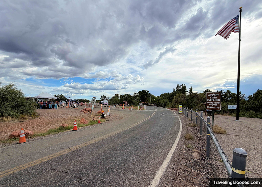 Paved access road leading past the payment booth toward Sedona A