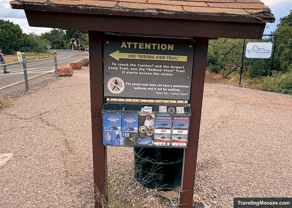 Wooden trail information kiosk directing hikers to use the Sedona View Trail