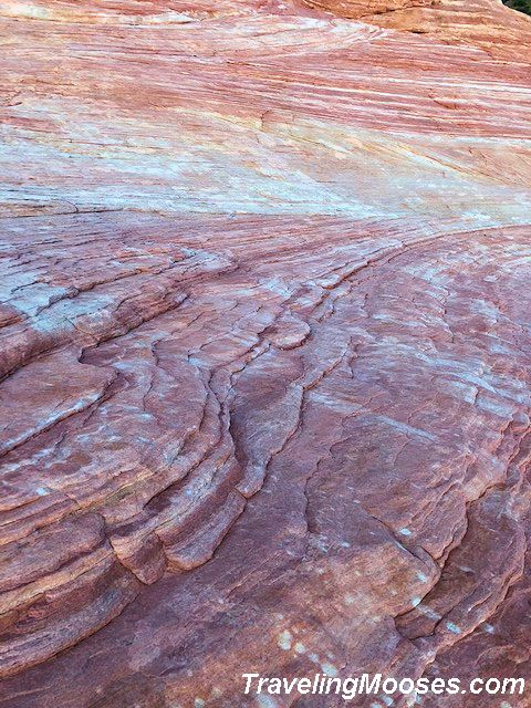 Red sandstone formations on fire wave trail