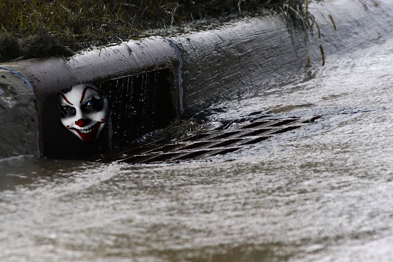 Clown in storm drain