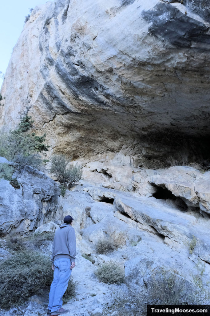 Man looking at Robber's Roost Cave in Nevada