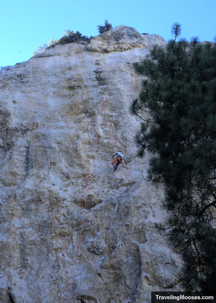 Climber scaling limestone cliff at Robbers' Roost