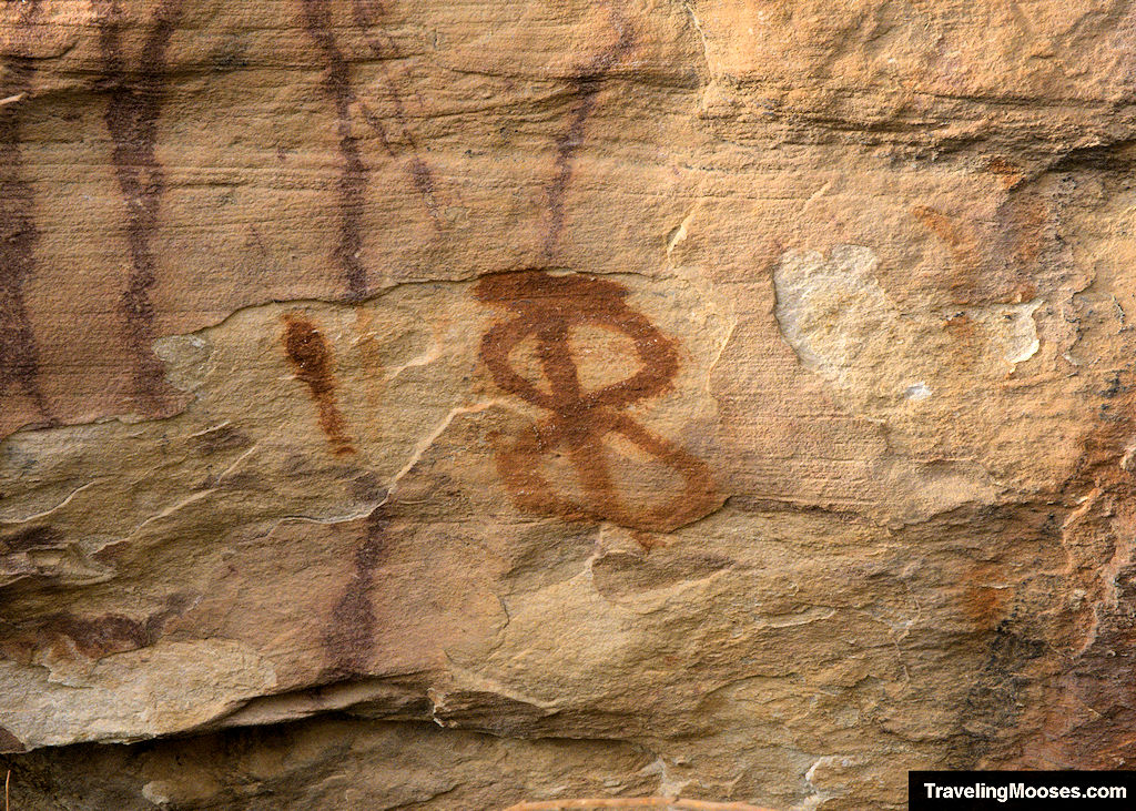 Red pictorgraph in the shape of a figure eight with a straight line drawn though the middle in Red Rock Canyon.