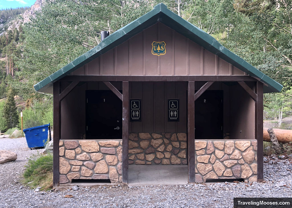 Primitive Restroom at Mary Jane Falls with large blue trash bin in the background