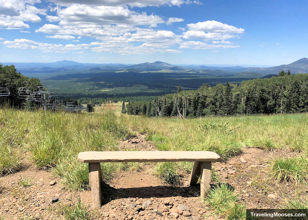 Bench on agassiz mountain with amazing view of the valley on a sunny ay