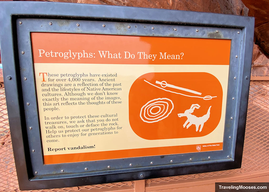 Orange sign describing meaning of Petroglyphs