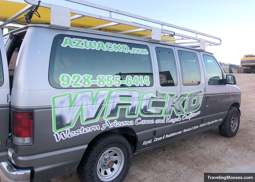 van hauling kayaks with wacko painted on the side