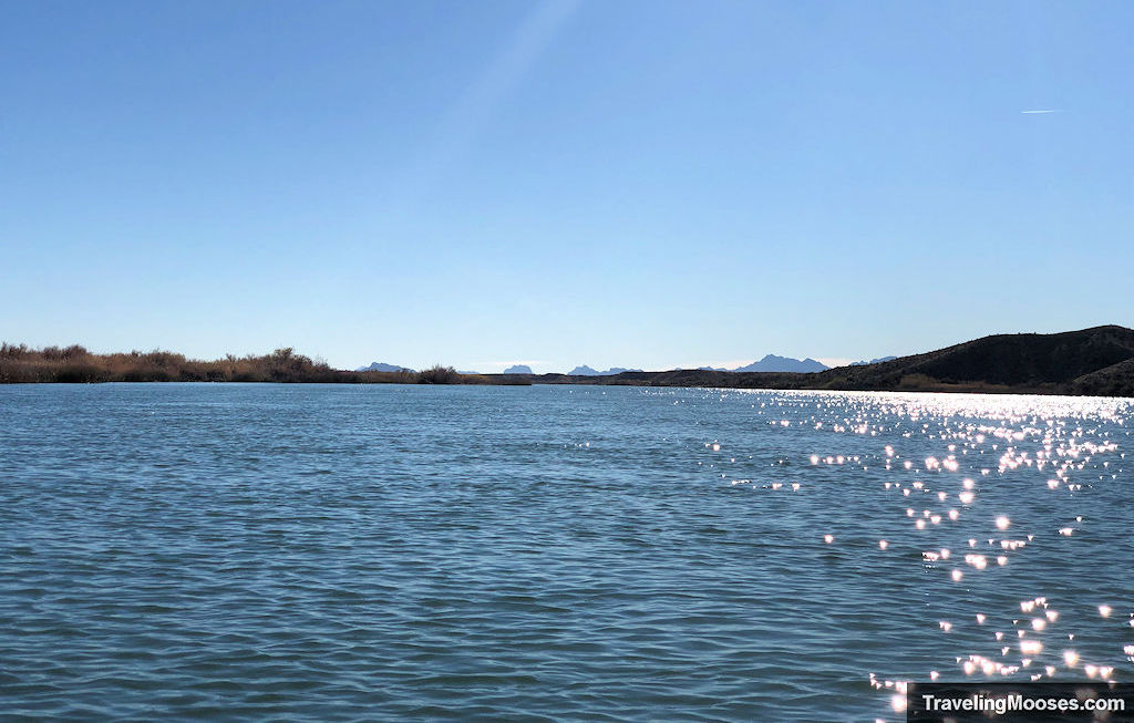 wide open view of colorado river and the sun is reflecting off the water