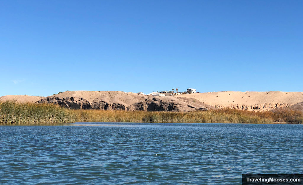 houses resting atop a bluff near colorado river