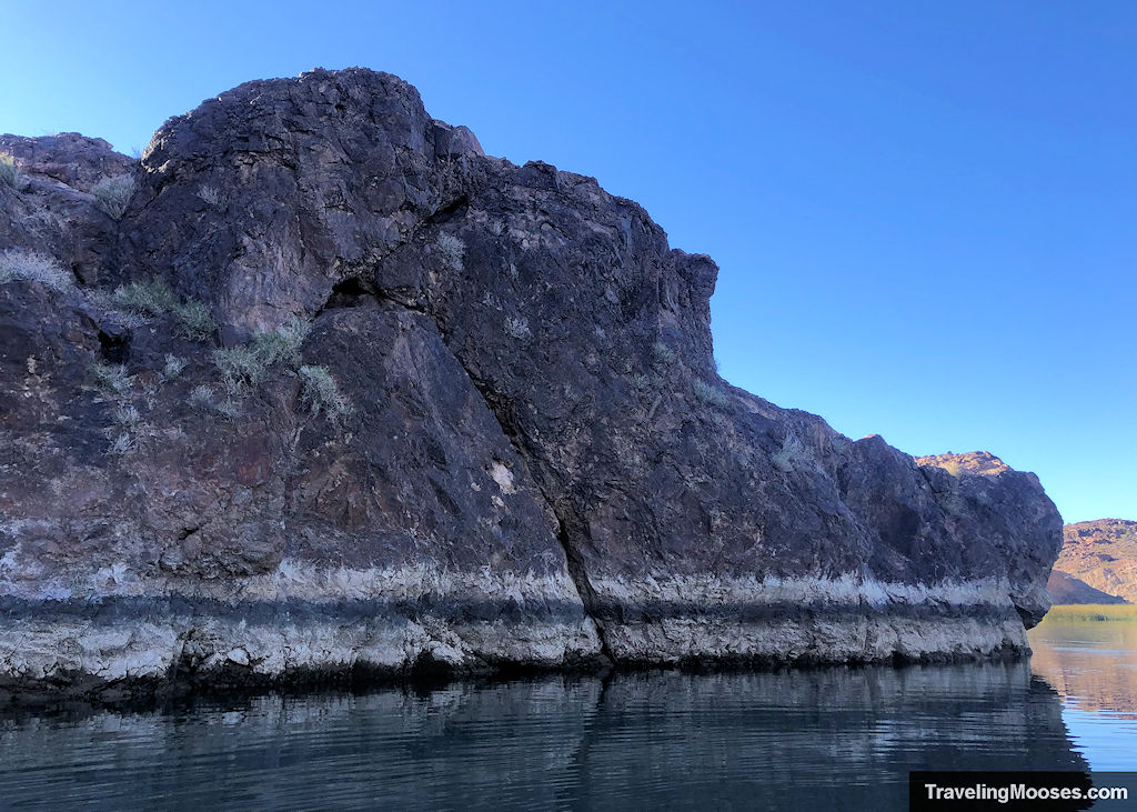 bathtub ring around picture rock on shores of colorado river