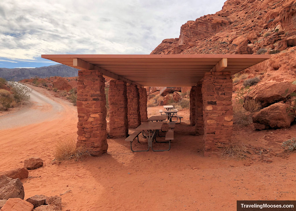 Picnic tables covered by structure to provide shade