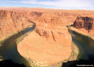 Large rock structure with the Colorado River bending around it, known as Horseshoe Bend