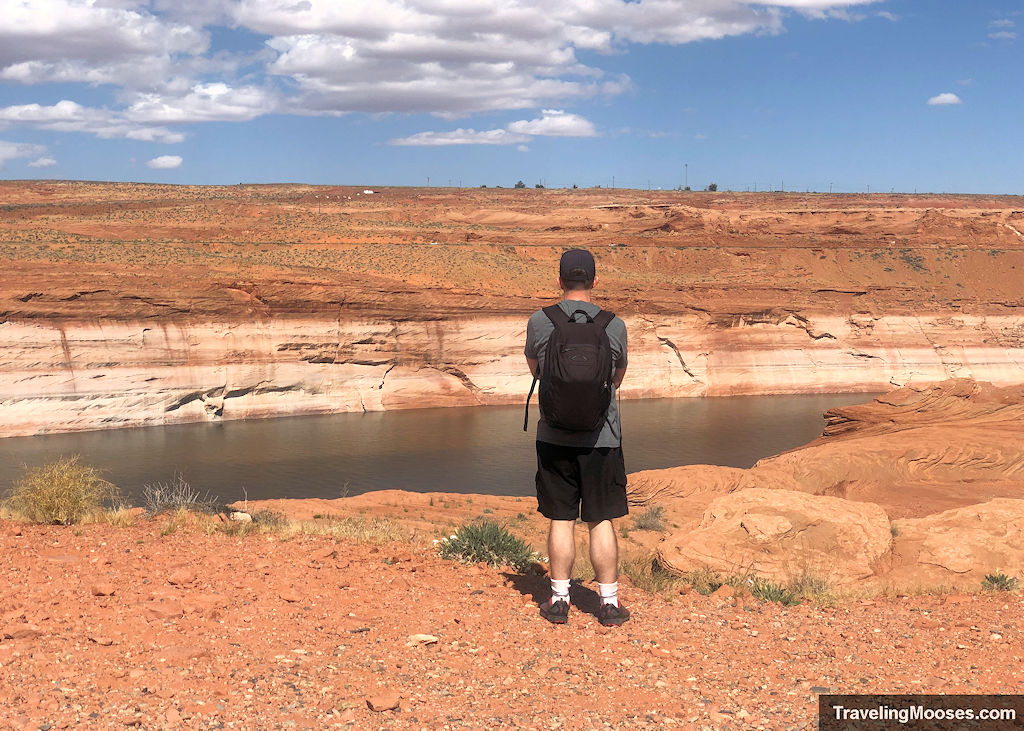 Man looking at the Colorado River along the Chains Trail hike in Page, AZ