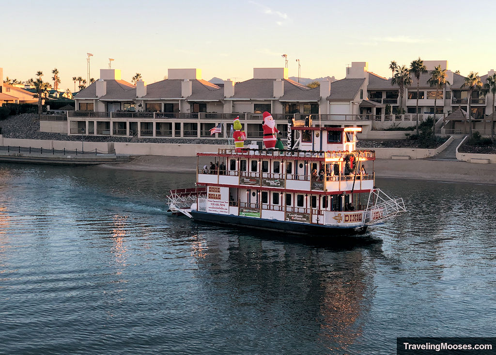 Vessel with Christmas decorations sailing through entry to Lake Havasu