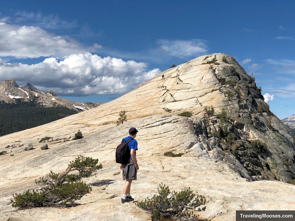 Man contemplating which way to scale Lembert Dome