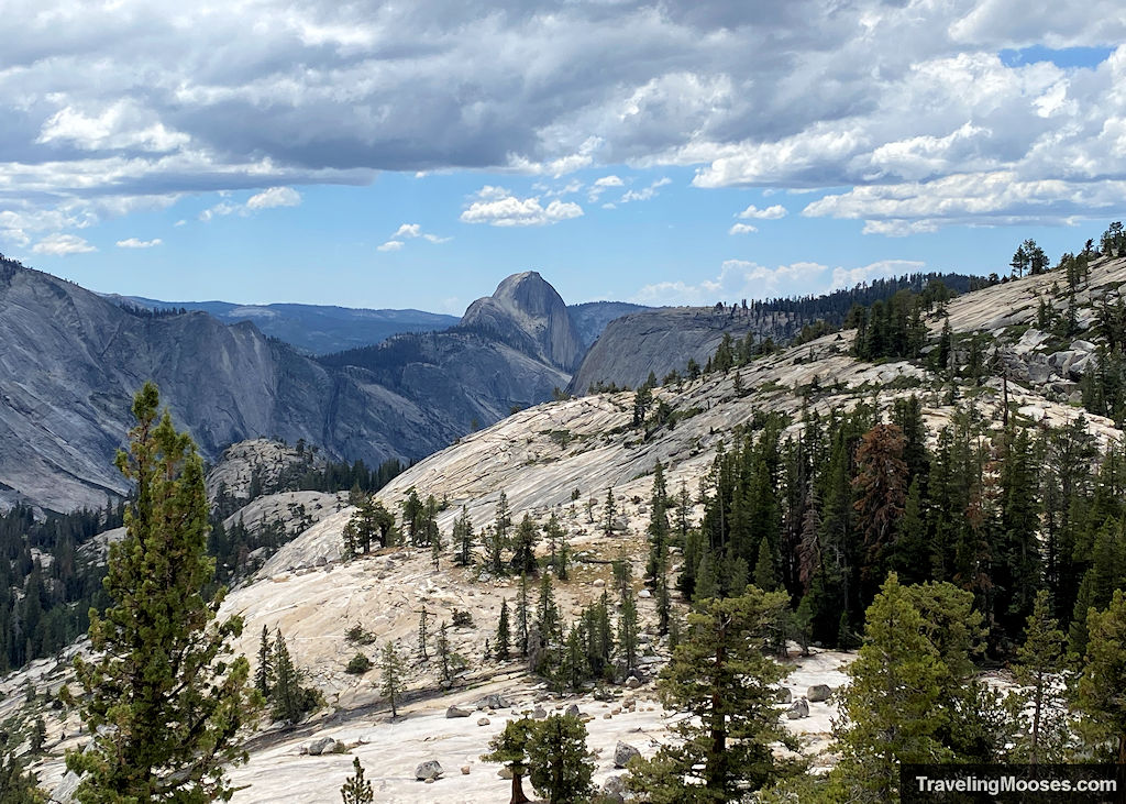 Half Dome seen in the distance surrounded by Tenaya Canyon
