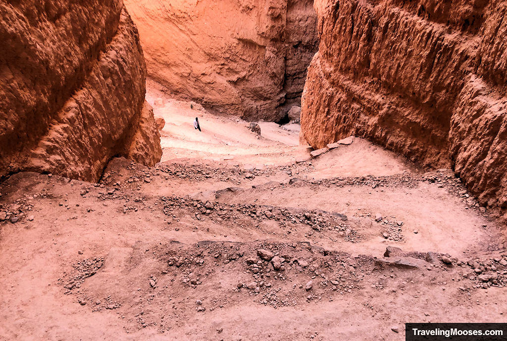 Descending down switchbacks through a slot canyon