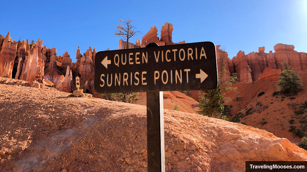 Sign along the Queens Garden trail in front of red hoodoos