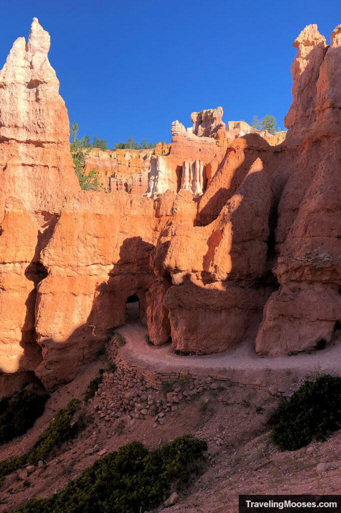 Path leading to an archway cut in the hoodoos