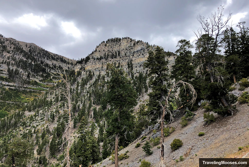 Rugged mountains against a dark cloudy sky