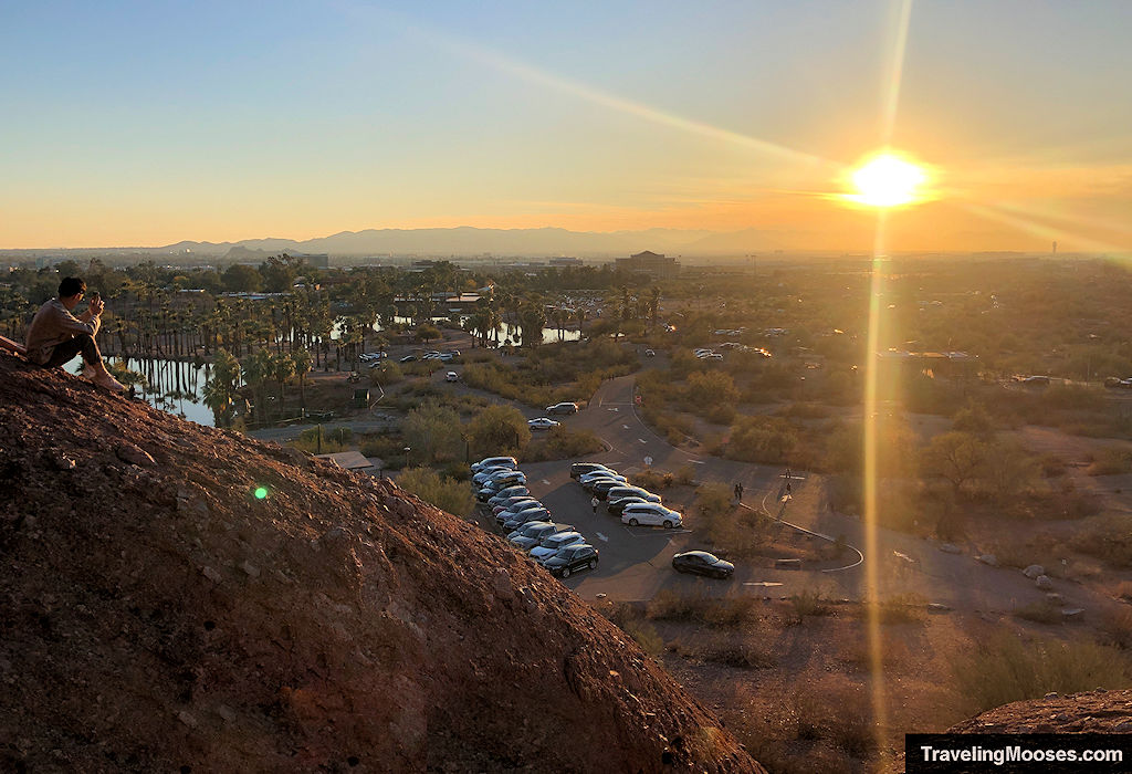 Man watches the sunset from the Hole in the Rock Trail at Papago Park