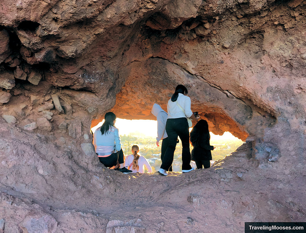 Visitors blocking the view to the hole in rock trail