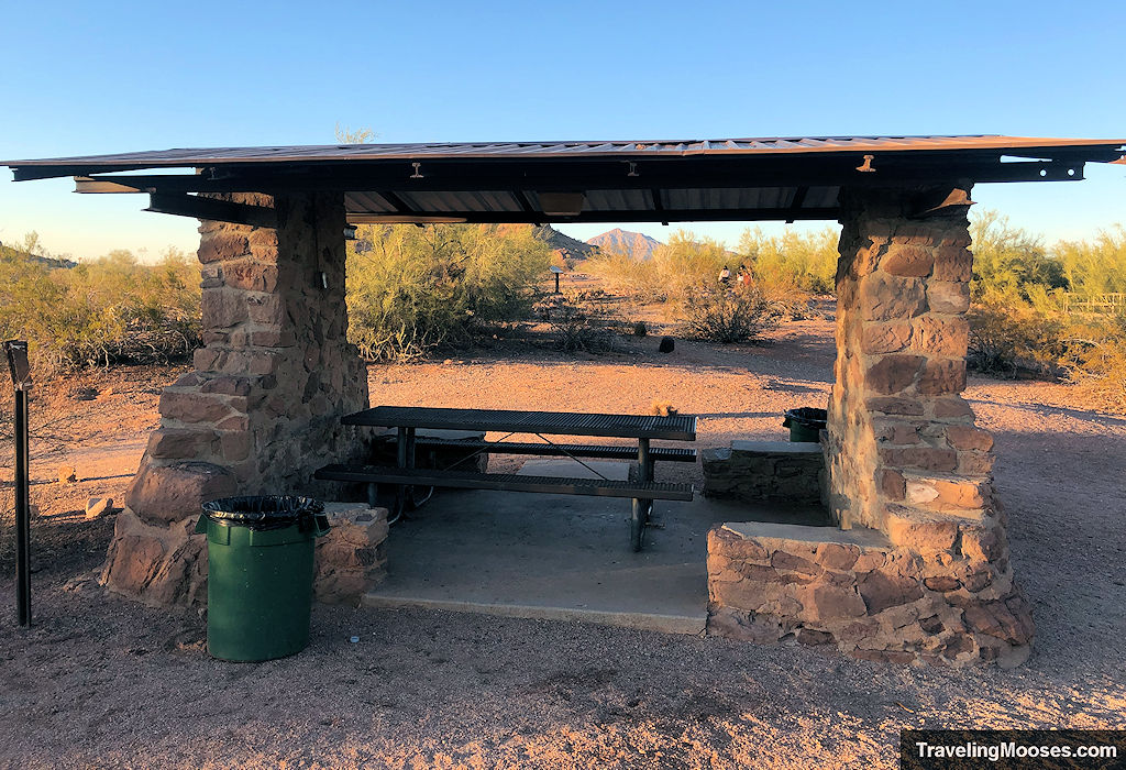 Picnic cover underneath a stone structure with shade cover