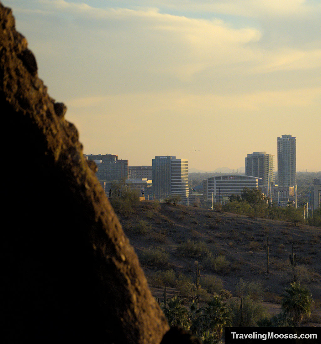 Partial view of Phoenix skyline through a rock opening