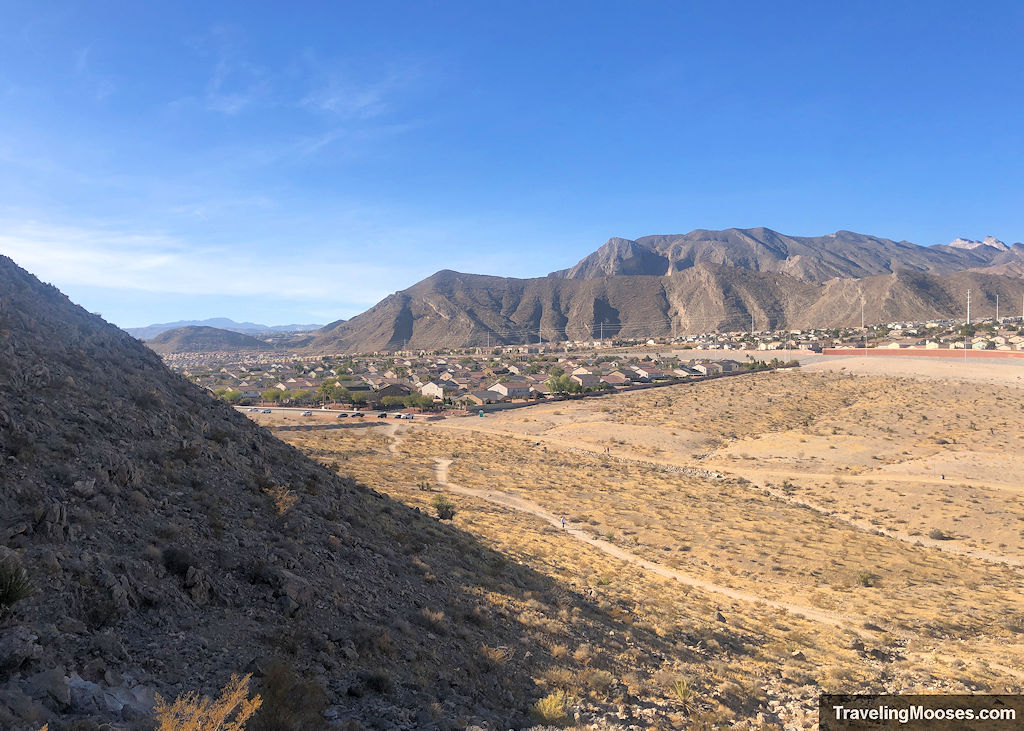 Rows of houses on the desert floor in the distance