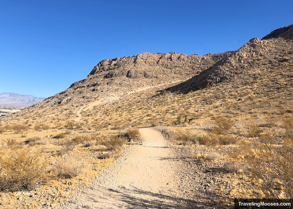 Gravel path winding up a rocky hill