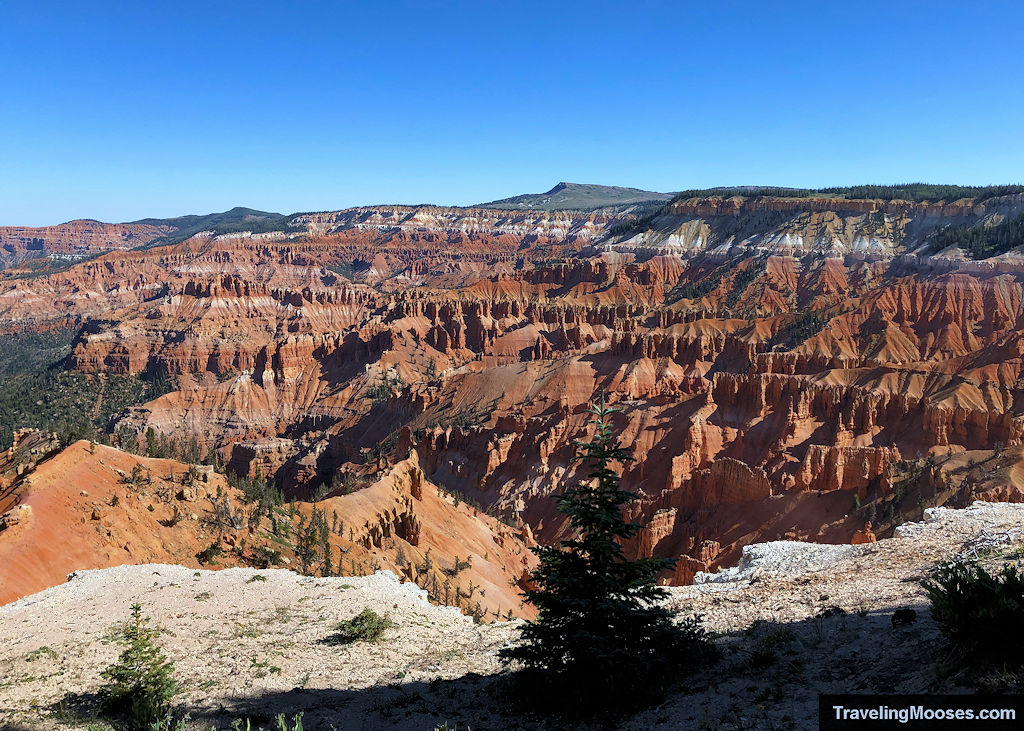 Wide view of the Cedar Breaks amphitheater from the Point Supreme Overlook, showing deep hoodoos, colorful cliffs, and surrounding ridgelines.