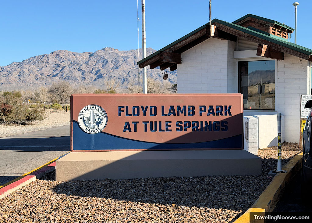 Red stone sign marking entrance to Floyd Lamb Park