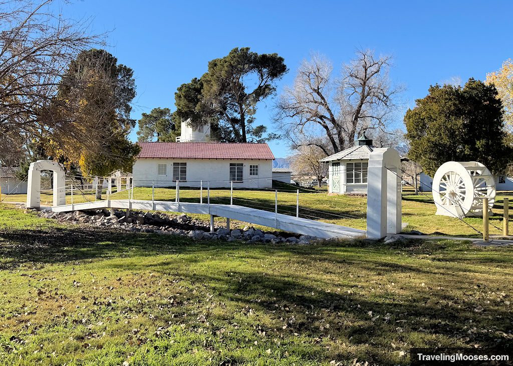 White Historic buildings and a bridge over a dry pond
