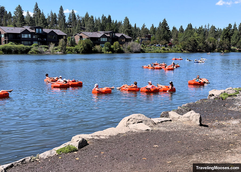 Orange tubes floating down a river