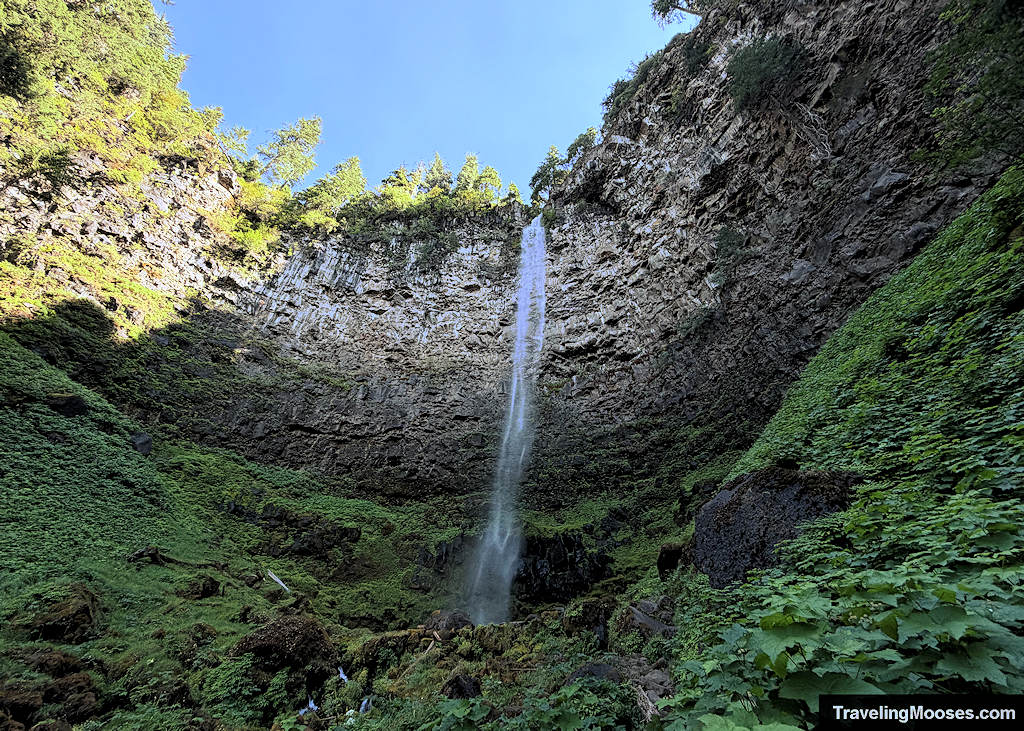 Waterfall cascading down lava basalt